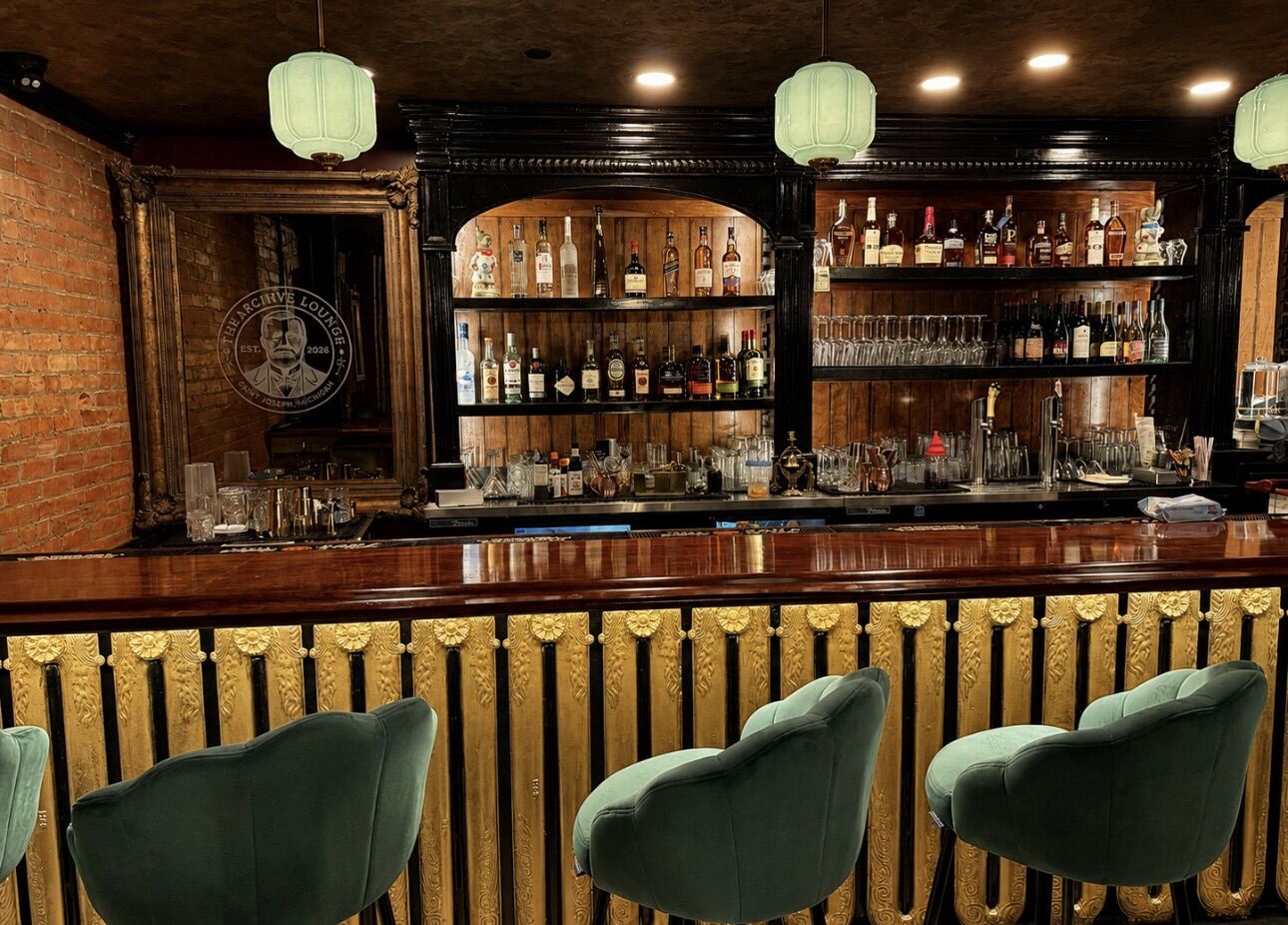 Green velvet stools at the radiator bar