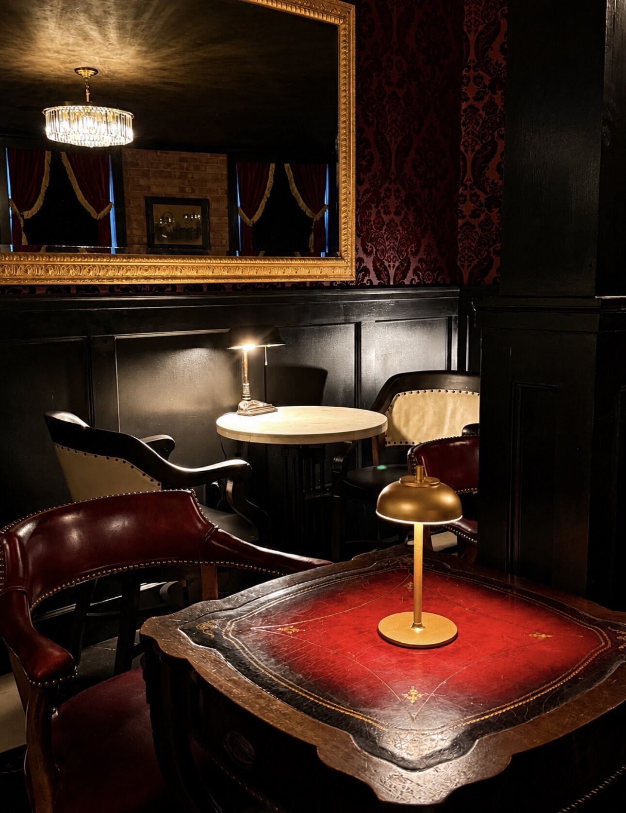Leather-top table and brass lamp