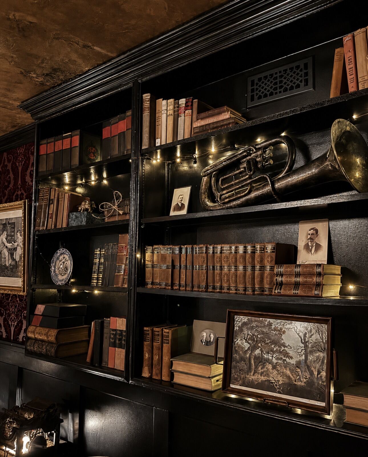 Brass instruments and old books on the archive shelves